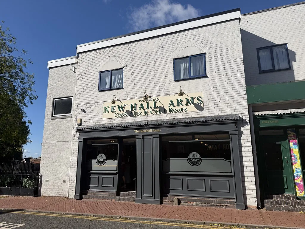 The New Hall Arms in Cannock, a painted brick shopfront with a sign reading New Hall Arms, Cask Ales and Craft Beers